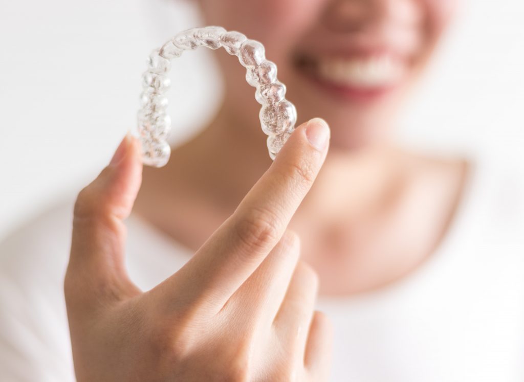 Clear custom mouth guard being held