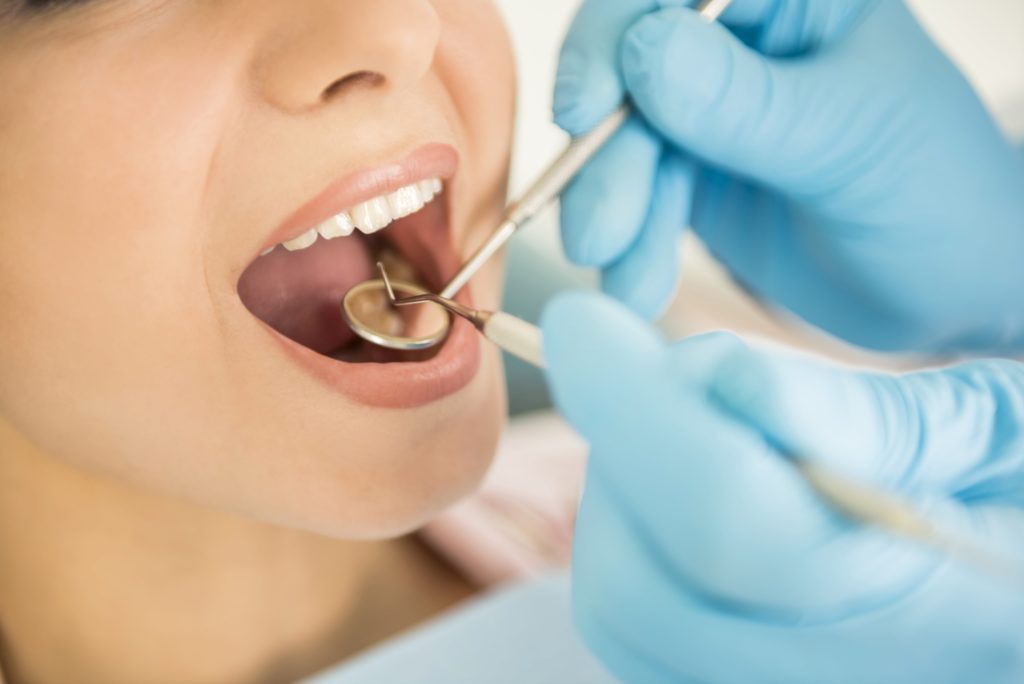 A lady getting a dental checkup