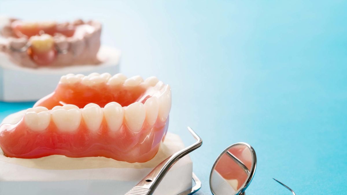 Full denture in blue background