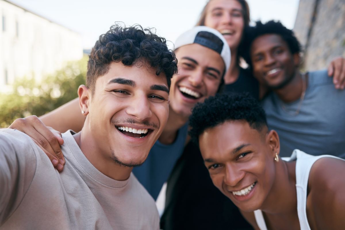 a group of young people taking a selfie